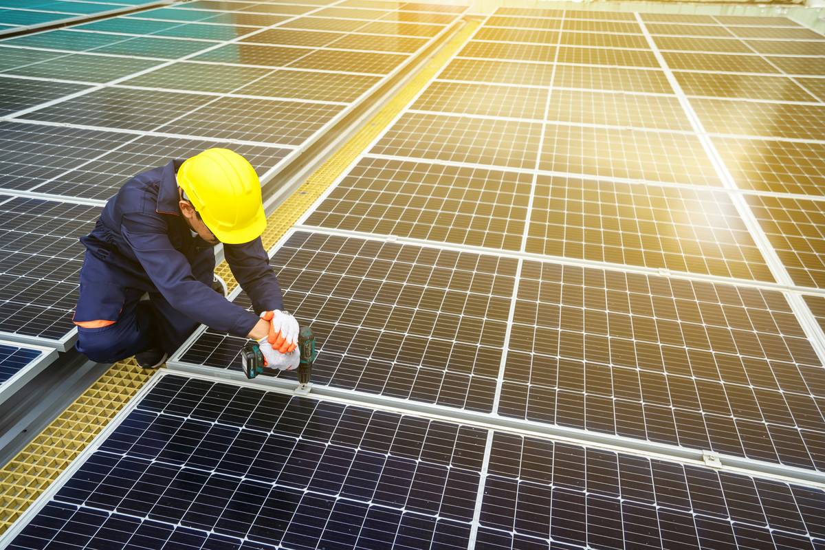 Contractor showing homeowner documentation for insurance backed guarantees for solar on rooftop system
